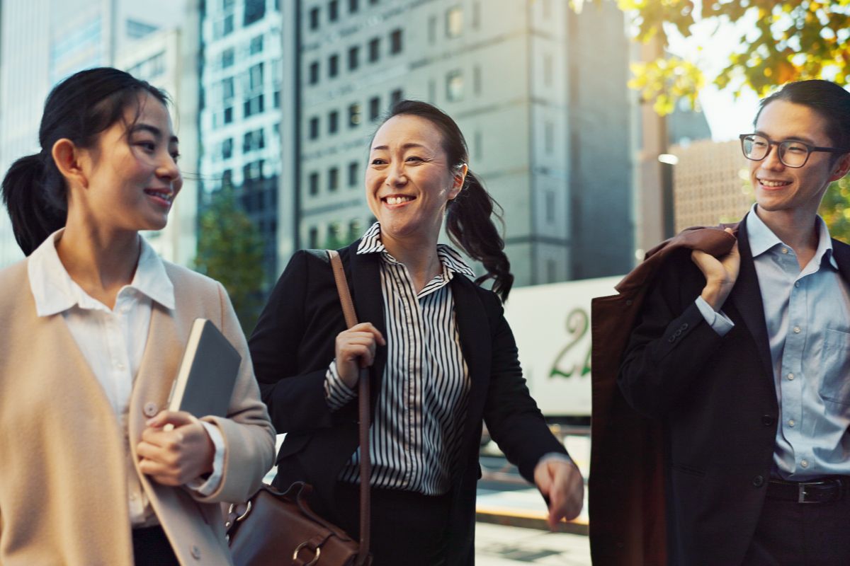 Young professionals walking together near office buildings in the city