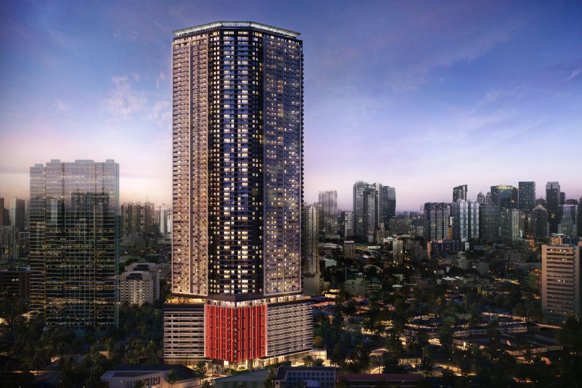Modern high-rise condominium tower in Pasig surrounded by the city skyline at dusk