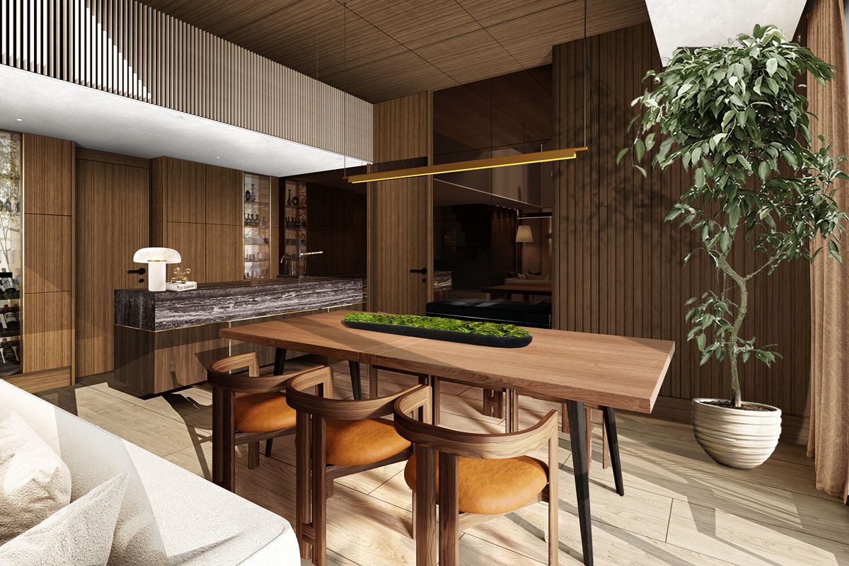 Condominium dining area with a wooden table, upholstered chairs, pendant lighting, wood-paneled walls, and a tall potted tree